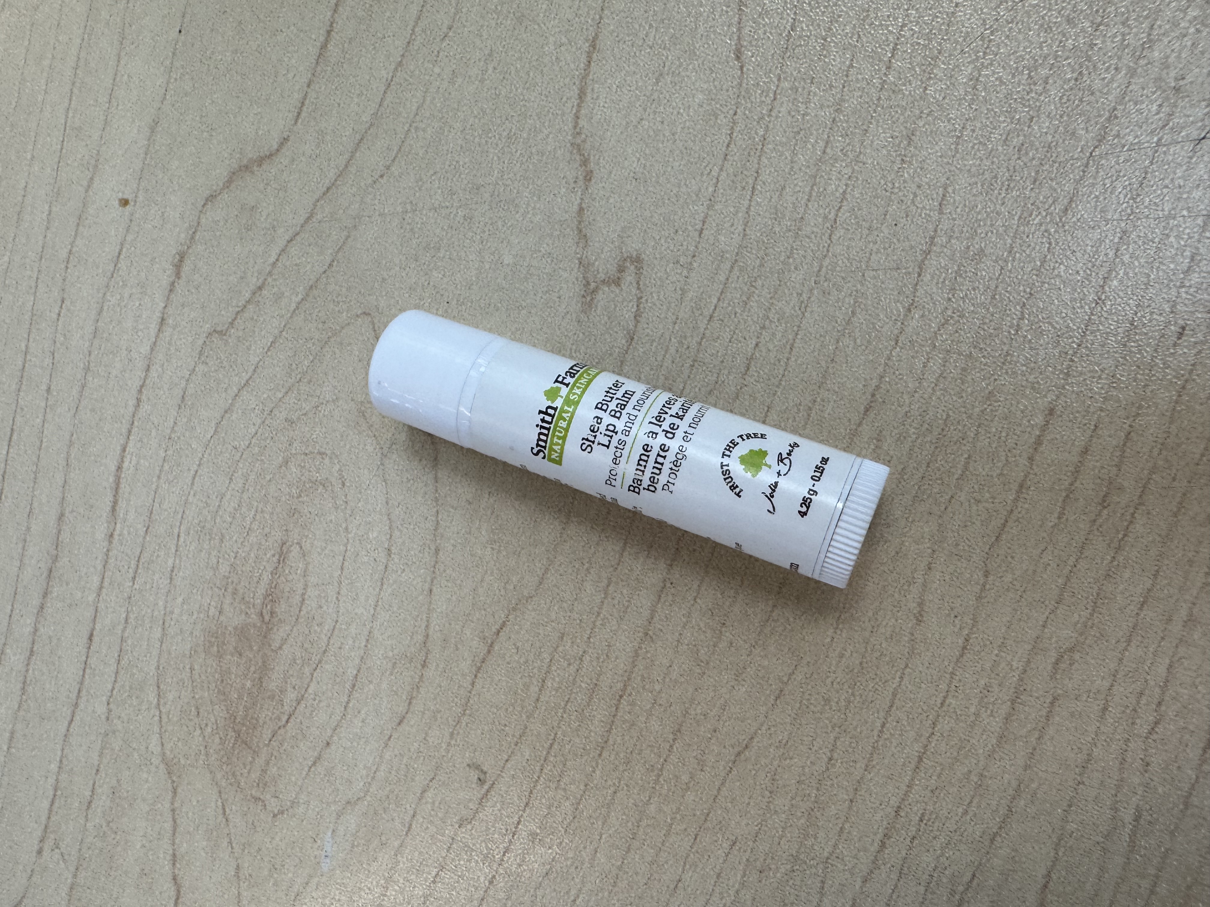 This is a high-angle shot image of a lip balm.